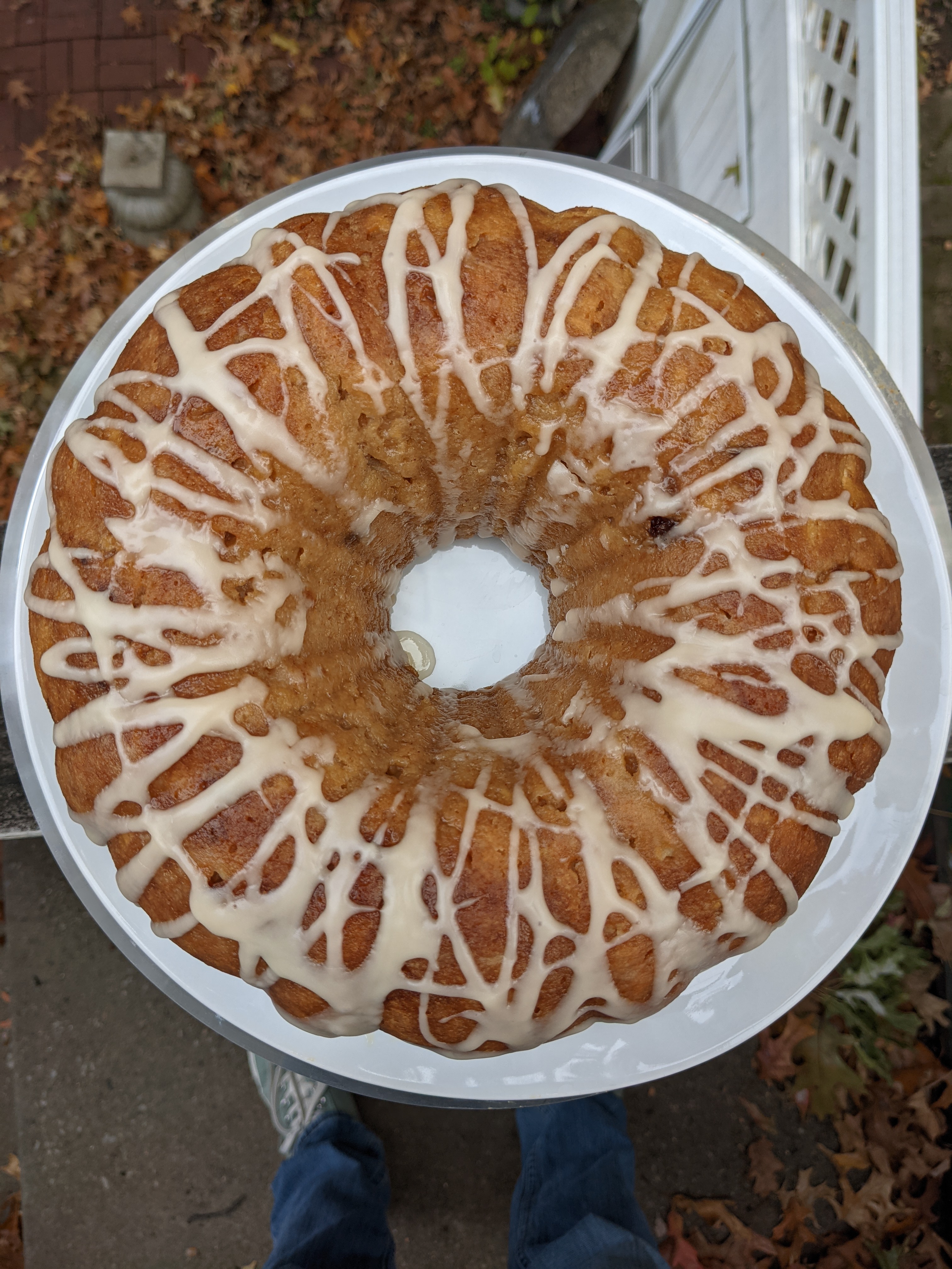 An apple bundt cake with a drizzle of white icing