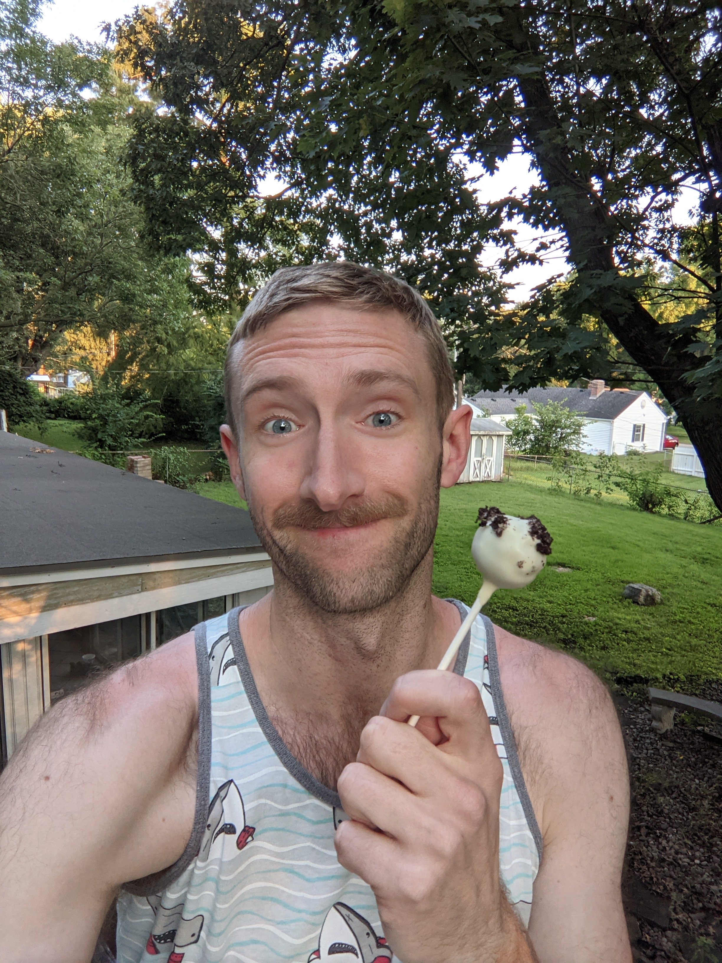 A selfie of me holding a cake pop