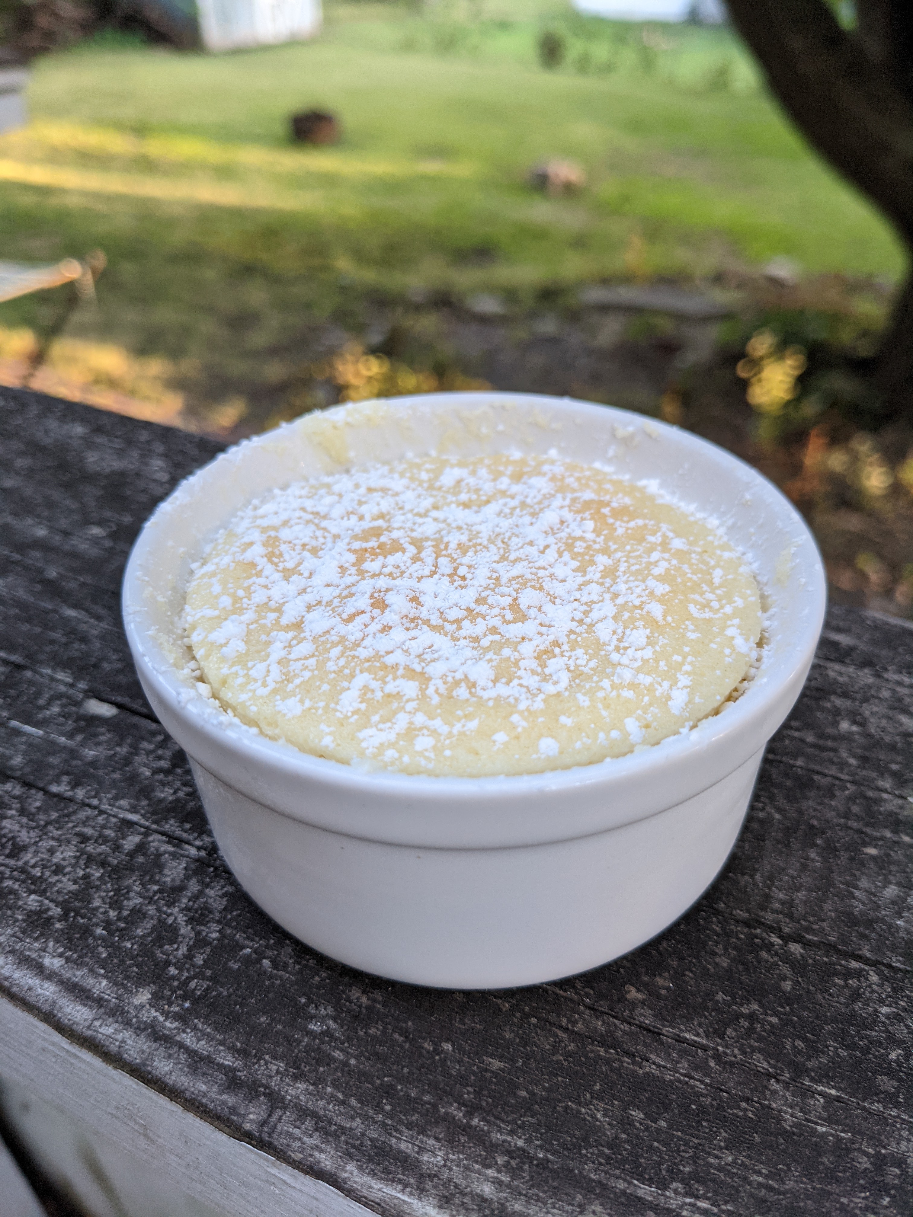 A ramekin with lemon pudding cake