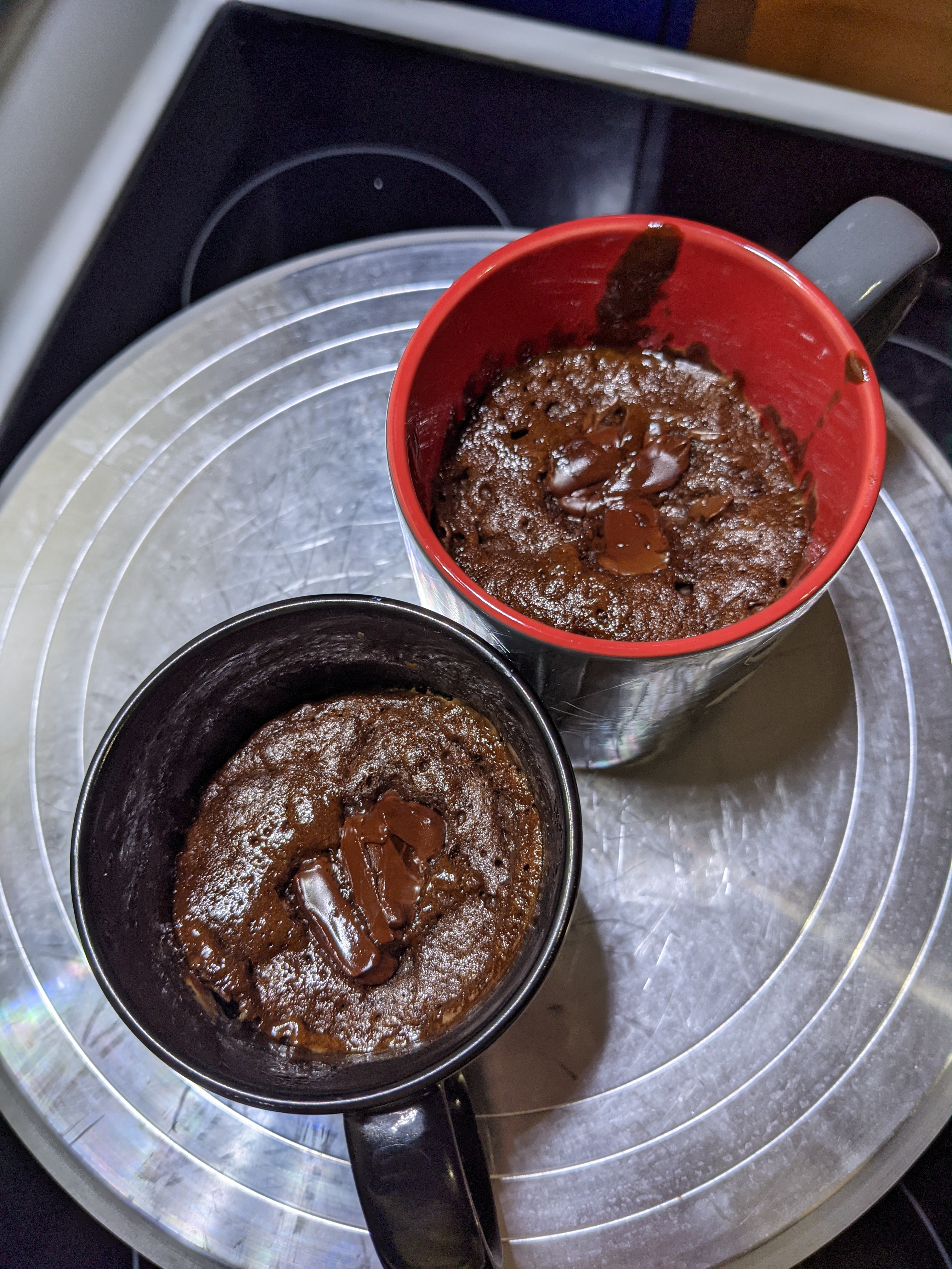 Two mugs of molten chocolate cake