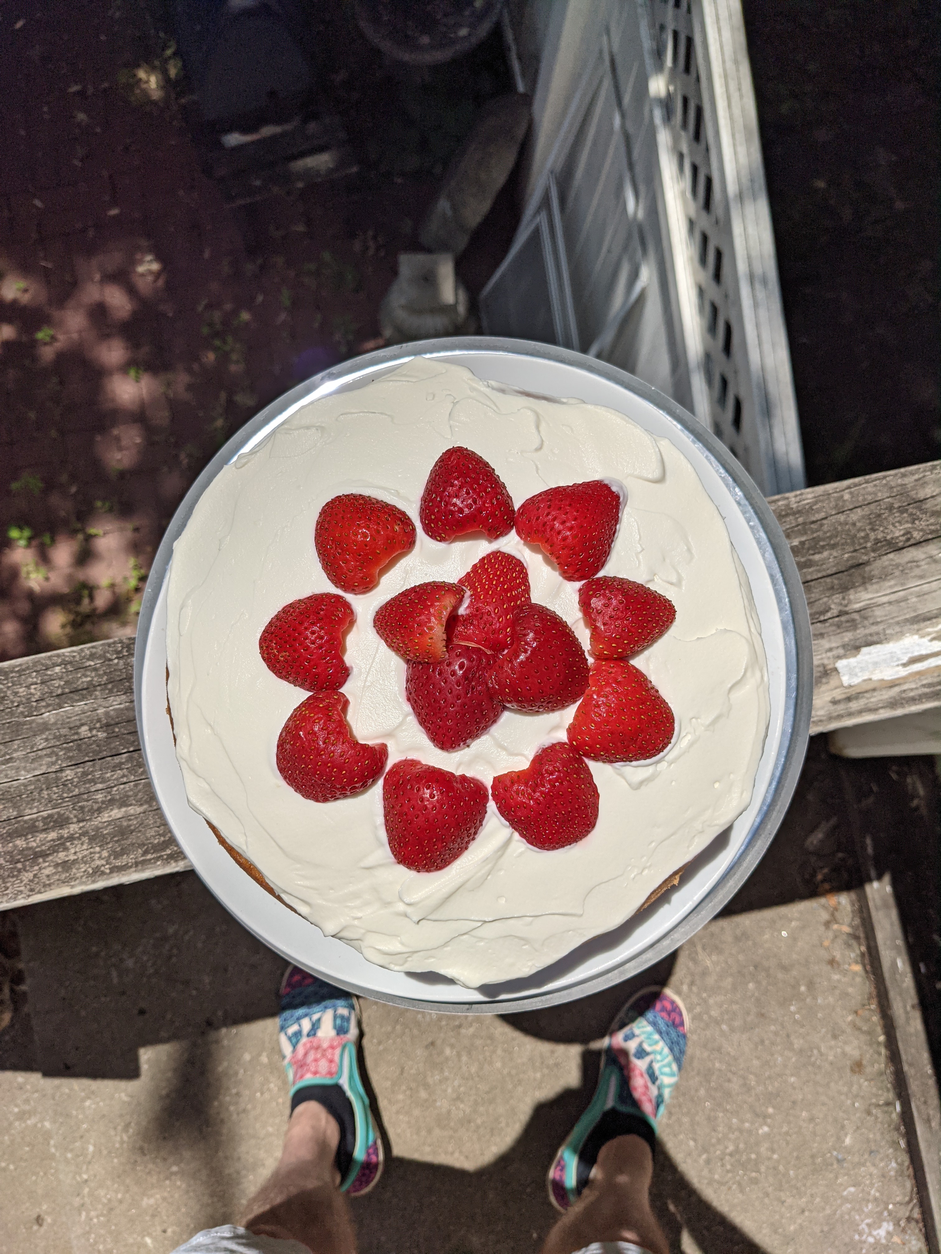 A top down view of a strawberry cream cake