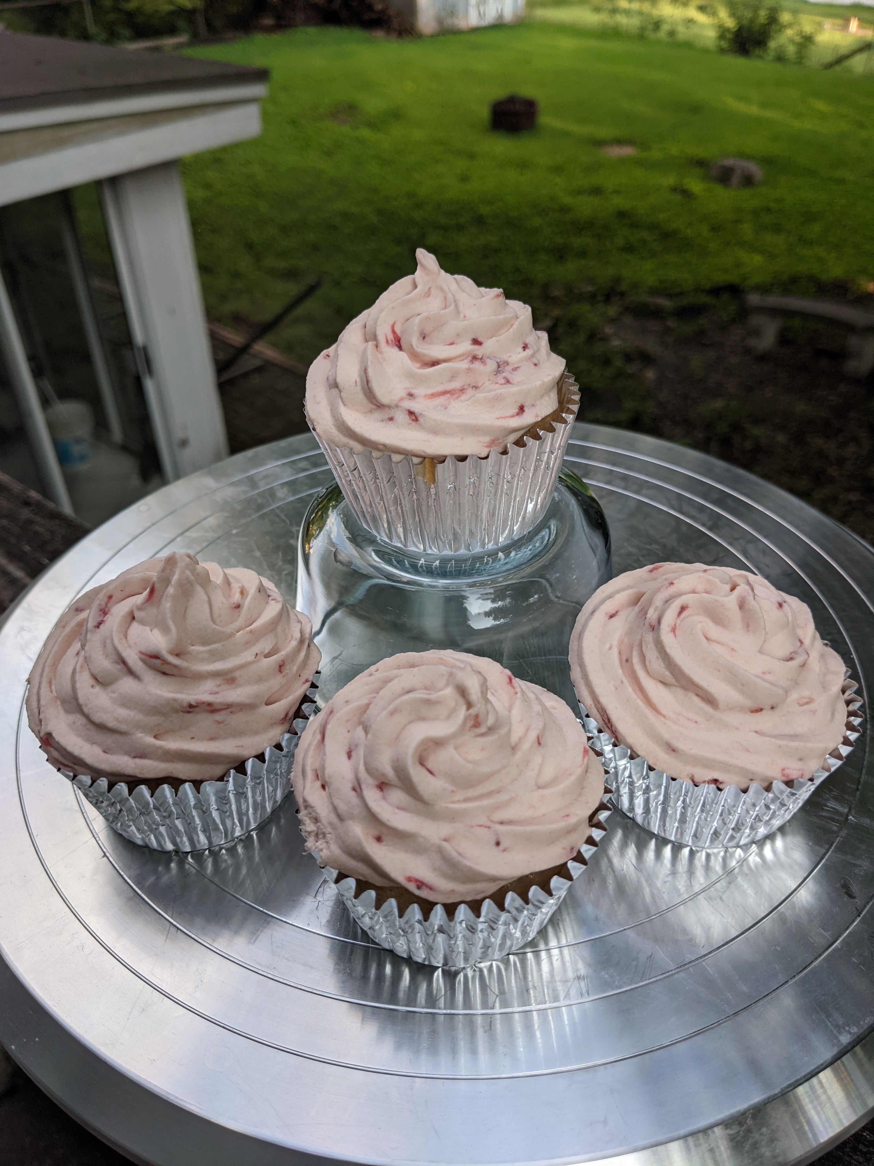 Four strawberry cupcakes.